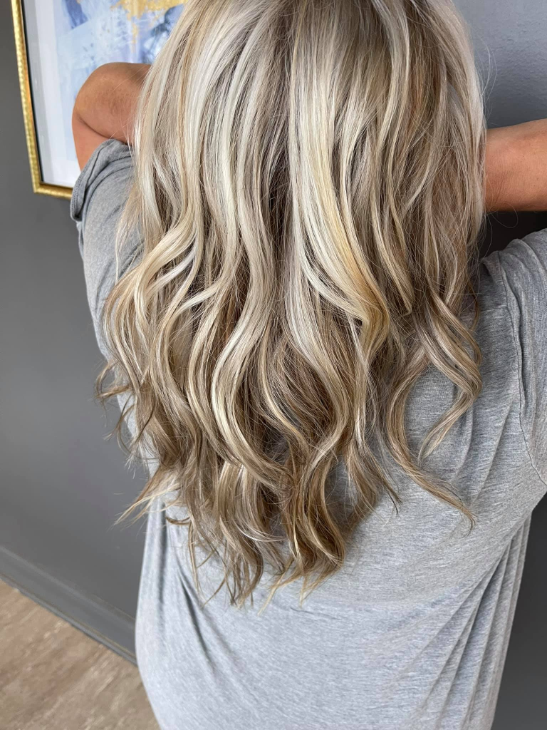 Face-shape focused blonding with blended, lived-in tones