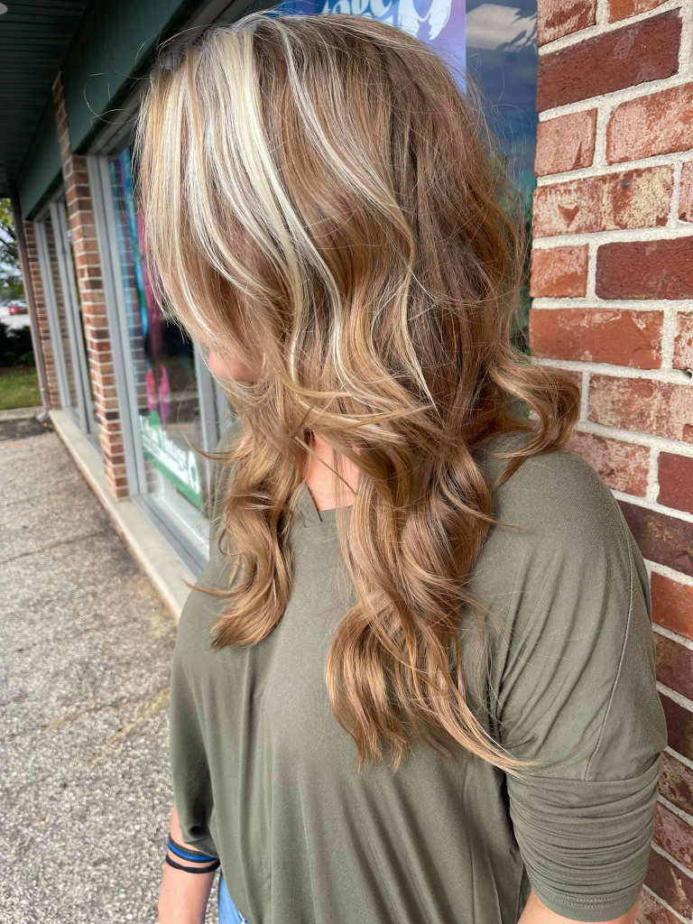 Custom haircut and blonding tailored to natural texture and growth patterns